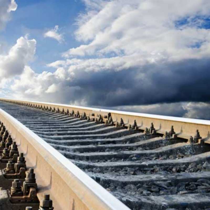 Открытка рельсы и шпалы железнодорожные пути на фоне неба Have a good trip 